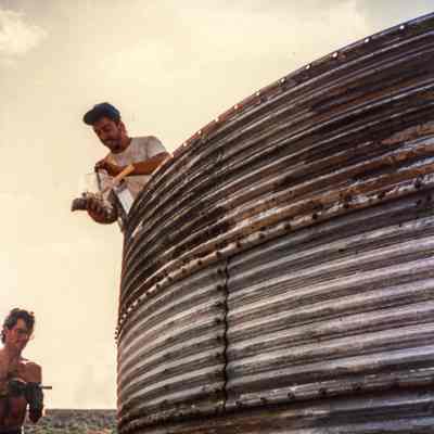 Men working on water catchment structure