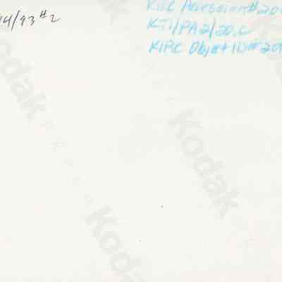 Handwritten notes on back of photo (object id #2013.018.248): The image displays the back of a Kodak photograph, featuring handwritten notes in black ink, including date and reference codes.