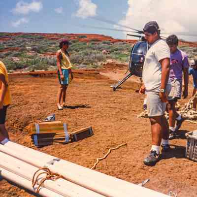People gathering construction materials