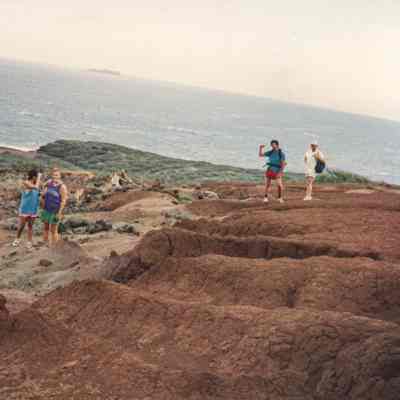 People exploring hardpan landscape