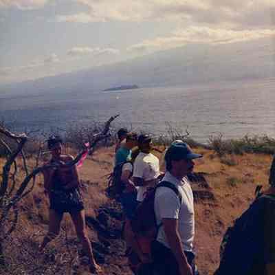 Group of people hiking up a trail