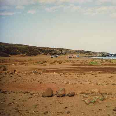 Distant view of people near a zodiac