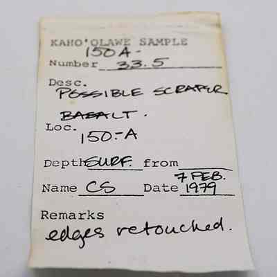 Artifact slip for possible basalt scraper: The image shows a labeled tag describing a sample called "Kahoolawe Sample 150A-33.5," identified as a possible basalt scraper.