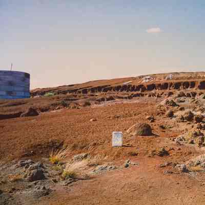 Hardpan terrain with sign