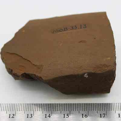 Basalt adze fragment with ruler: Original size: 6.84 cm (l); Original format: Artifact; Resolution: 200 dpi