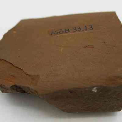 Basalt adze fragment with alternate id number  visible: Original size: 6.84 cm (l); Original format: Artifact; Resolution: 200 dpi