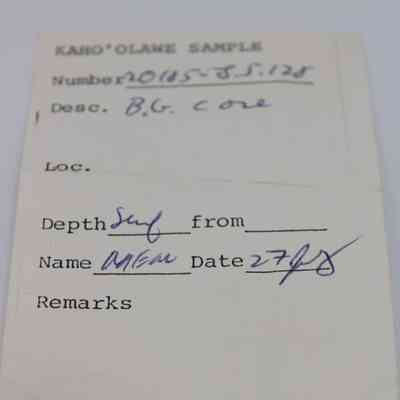 Artifact slip for basaltic glass core: The image shows a labeled artifact slip for a sample, detailing ID number, description, location, depth, name, and date filled manually.