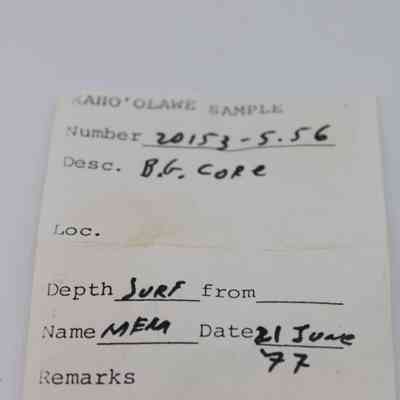 Artifact slip for basaltic glass core: The image shows an artifact slip labeled "Kaho'olawe Sample" with details like number, depth, and date, handwritten with notes.