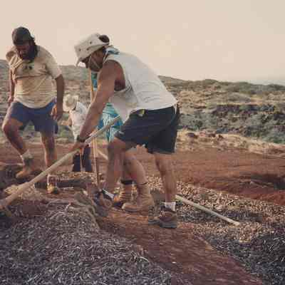 Several men working with soil