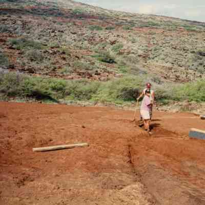 People working above water catchment structure