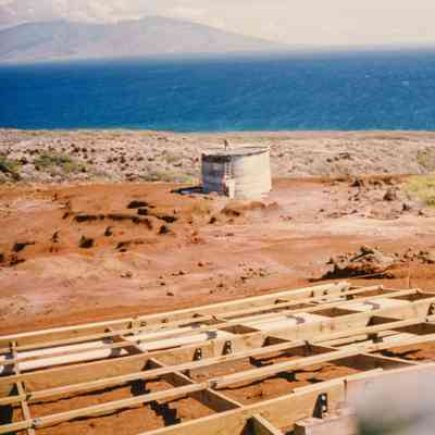Wooden frame and distant view of water tank