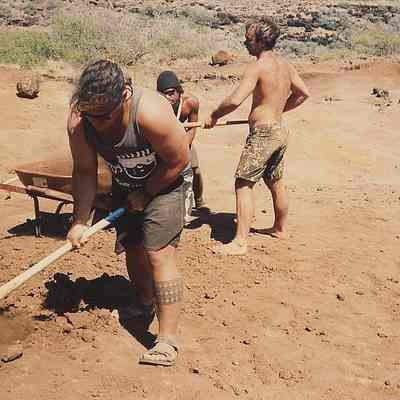 Three men working on hardpan