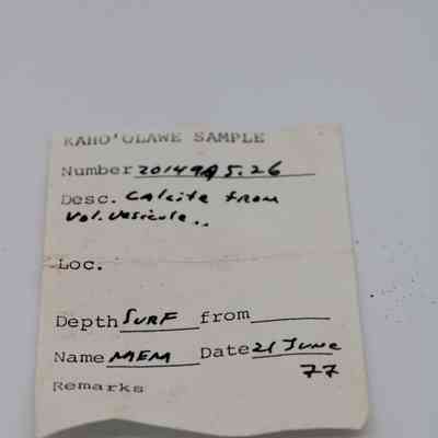 Artifact slip for a piece of calcite: The image shows an artifact slip describing a calcite sample from Kahoʻolawe, dated 21 June, 1977 with various handwritten details.