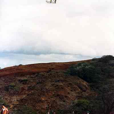 Helicopter above a group of men