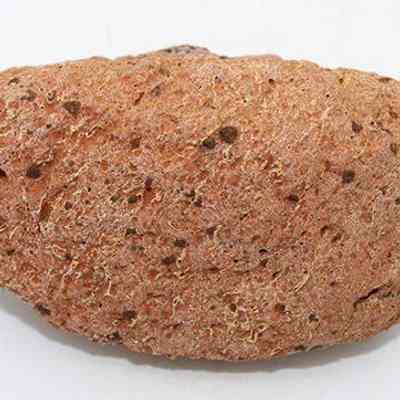 Base of a small breadloaf sinker: The image shows a roughly oval-shaped, brown volcanic rock with a porous texture, commonly used as a sinker.