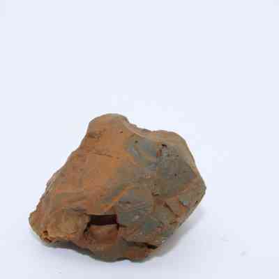 Basaltic glass core: The image shows a rugged basaltic glass core, exhibiting a mix of reddish and grayish hues.