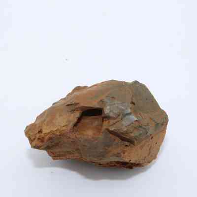 Profile of basaltic glass core: The image shows a weathered basaltic glass core with a rough, earthy brown surface, showcasing its natural geological texture.