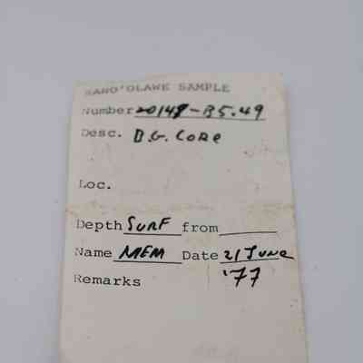 Artifact slip for basaltic glass core: The image shows an artifact slip with handwritten details for a sample collected on June 21, 1977, collected by someone marked as MEM.