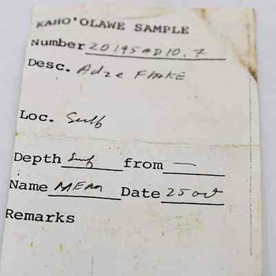 Artifact slip for adze (ko'i) flake: The image shows an artifact slip labeled "Kaho'olawe Sample" with details like number, description, location, depth, name, and date collected.