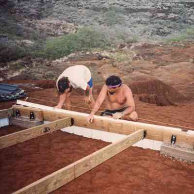 Men working on structure's foundation