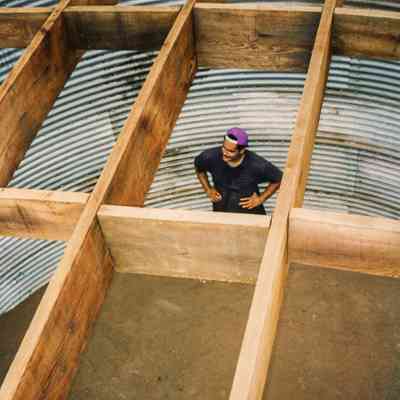 Man standing on bottom of water tank