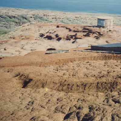 Texture hardpan terrain with water catchment and water storage structures