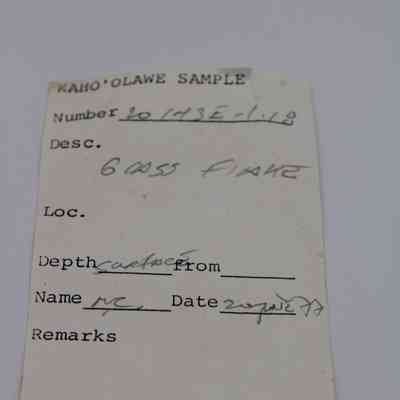 Artifact slip for glass flake: The image depicts an artifact slip labeled "Kaho’olawe Sample" with details like number "20 173E-1L1", description and date collected.