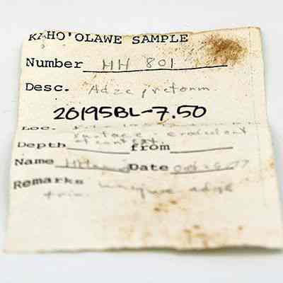 Artifact slip for adze preform: This artifact slip shows a sample labeled "Kaho‘olawe Sample," with number HH 801, describing an "Adze, preform."