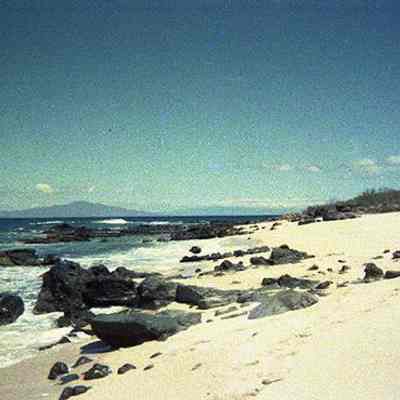 White sandy beach with Maui in the background