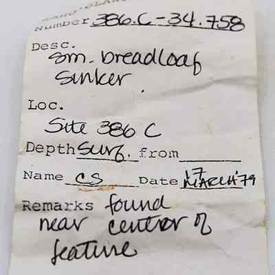 Artifact slip for a small breadloaf sinker: The image shows a sample label for a breadloaf sinker, found at site 386 C. It was documented by C.S. on March 17, 1979.