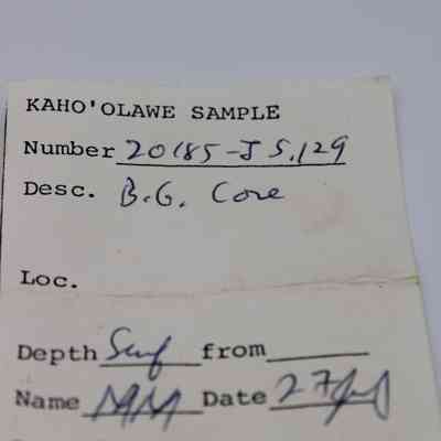 Artifact slip for a basaltic glass core: The image shows an artifact slip labeled "Kaho'olawe Sample," detailing sample number, description, location, depth, name, and date.