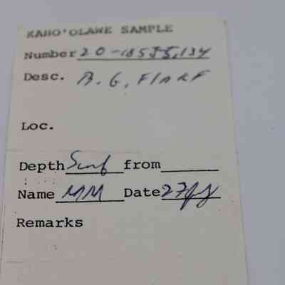 Artifact slip for basaltic glass flake: The image shows an artifact slip labeled "Kaho'olawe Sample," detailing its number, description, location, depth, and associated remarks.