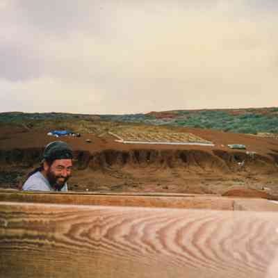 Dan Holmes looking over wooden frame