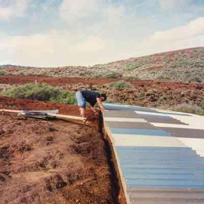 Person working on water catchment structure
