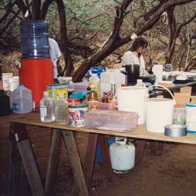People working in kitchen area of camp