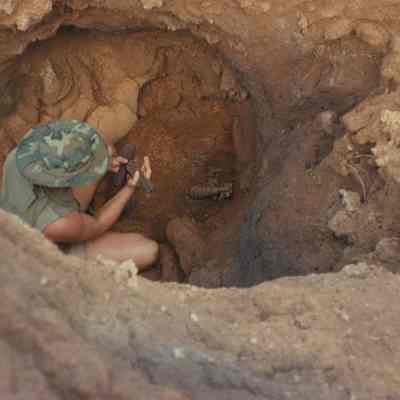 Man examining ordnance-Mauka II