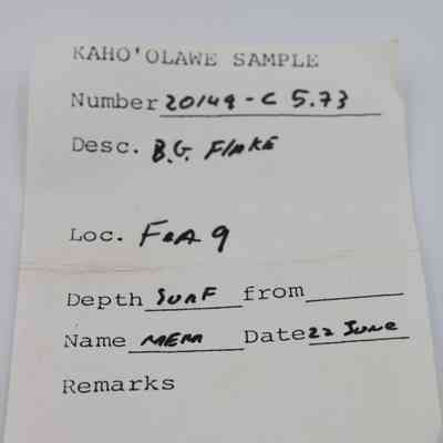 Artifact slip for basaltic glass flake: The artifact slip details a sample from Kaho’olawe with number 20149-C 5.73, B.G. Flake.