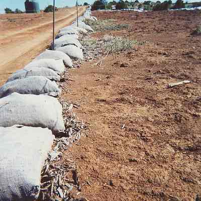 Stuffed burlap bags along road