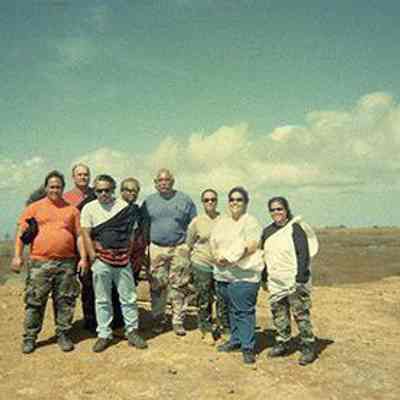 Group of people in front of rain ko'a (shrine)