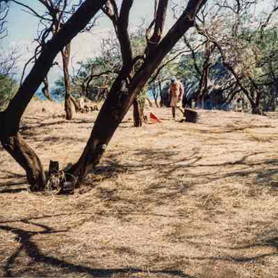 Distant view of man looking at canister