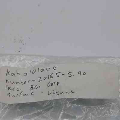 Artifact bag label for basaltic glass core: The image shows an artifact bag label with handwritten details, including location "Kaho'olawe,"and  number "20165-5.90," description