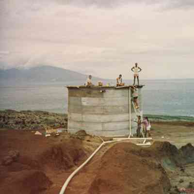 People working on water tank