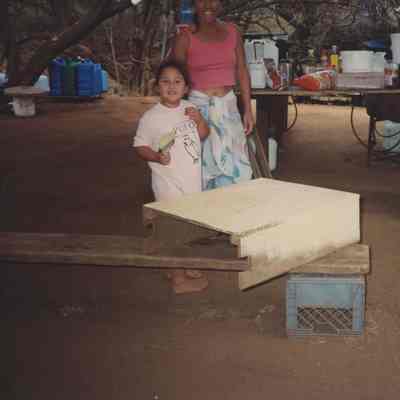 Woman and child near a table