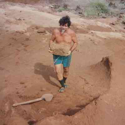 Man carrying rock