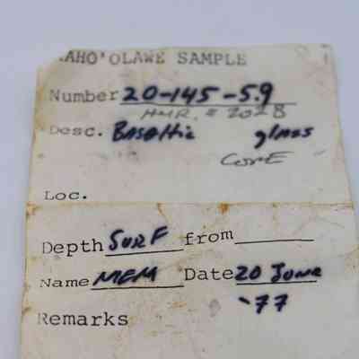Artifact slip for basaltic glass core and pieces: The image shows a weathered document labeled "Kaho'olawe Sample," describing a basaltic glass core collected on June 20, 1977