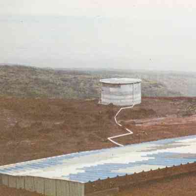 People working on water catchment structure
