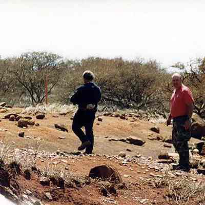 Two people on hard pan terrain