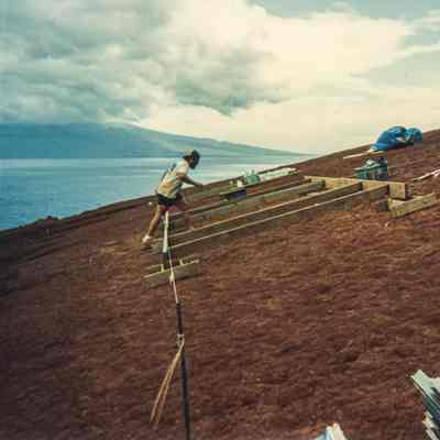 Man walking over wooden frame