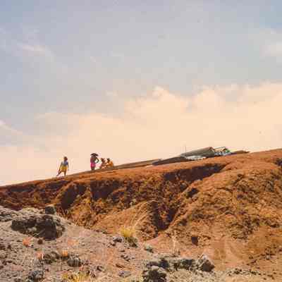 Distant view of people sitting and standing at a construction side