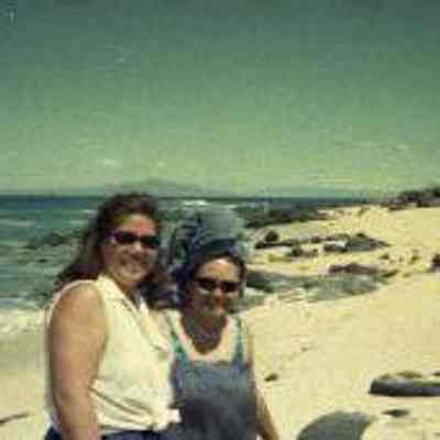 Two women on sandy white beach